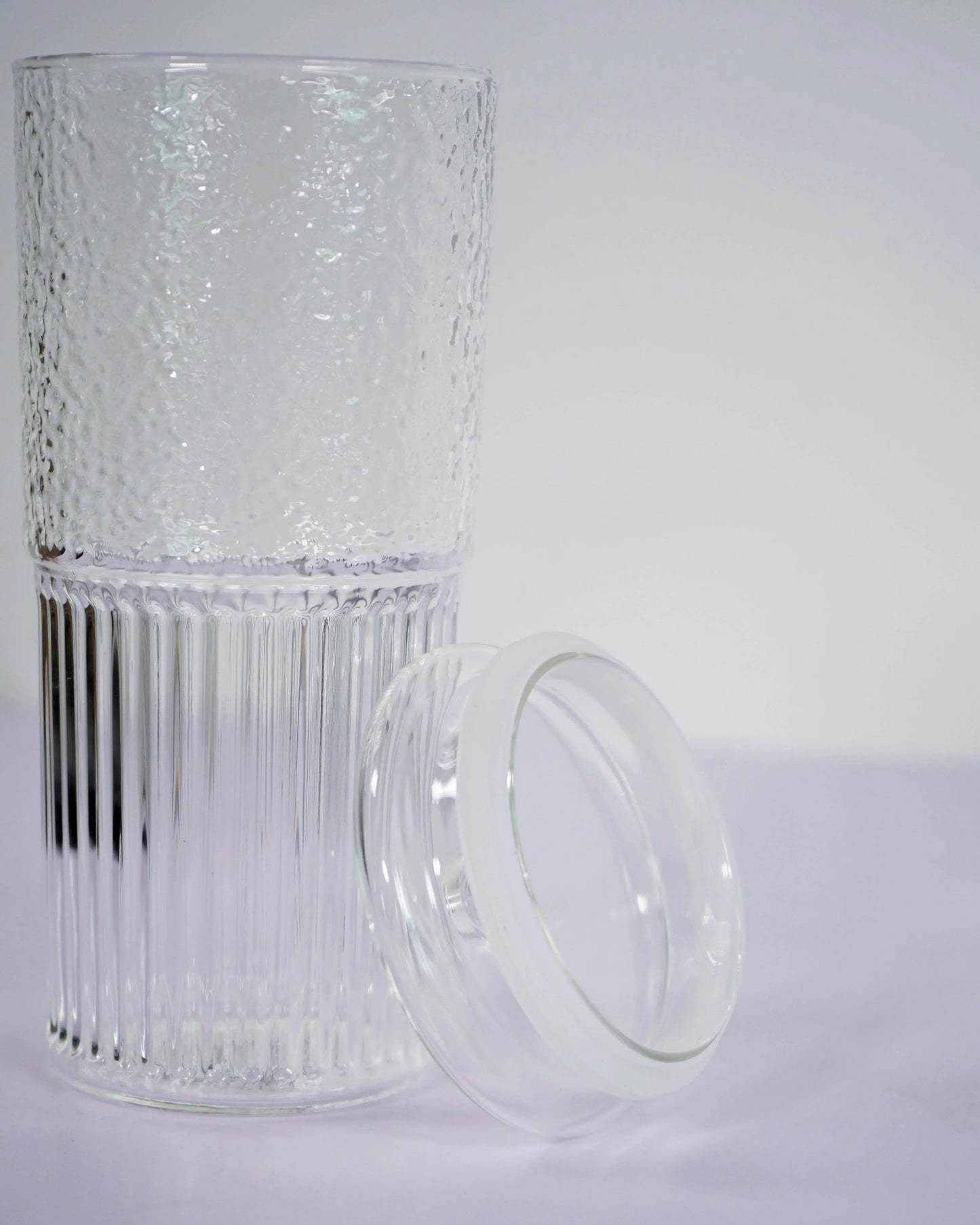 glass cup with rubber around lid